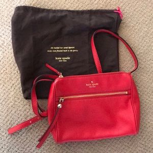 Red Kate Spade over the shoulder purse.
